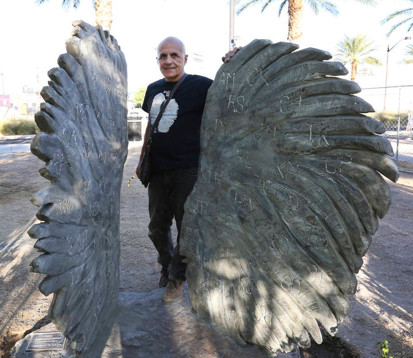 Bobby Jacobs and his sculpture Love and Courage